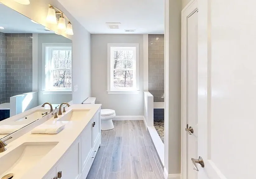 Primary bath double sink kohler faucets glass tile ceramic wood tile floor