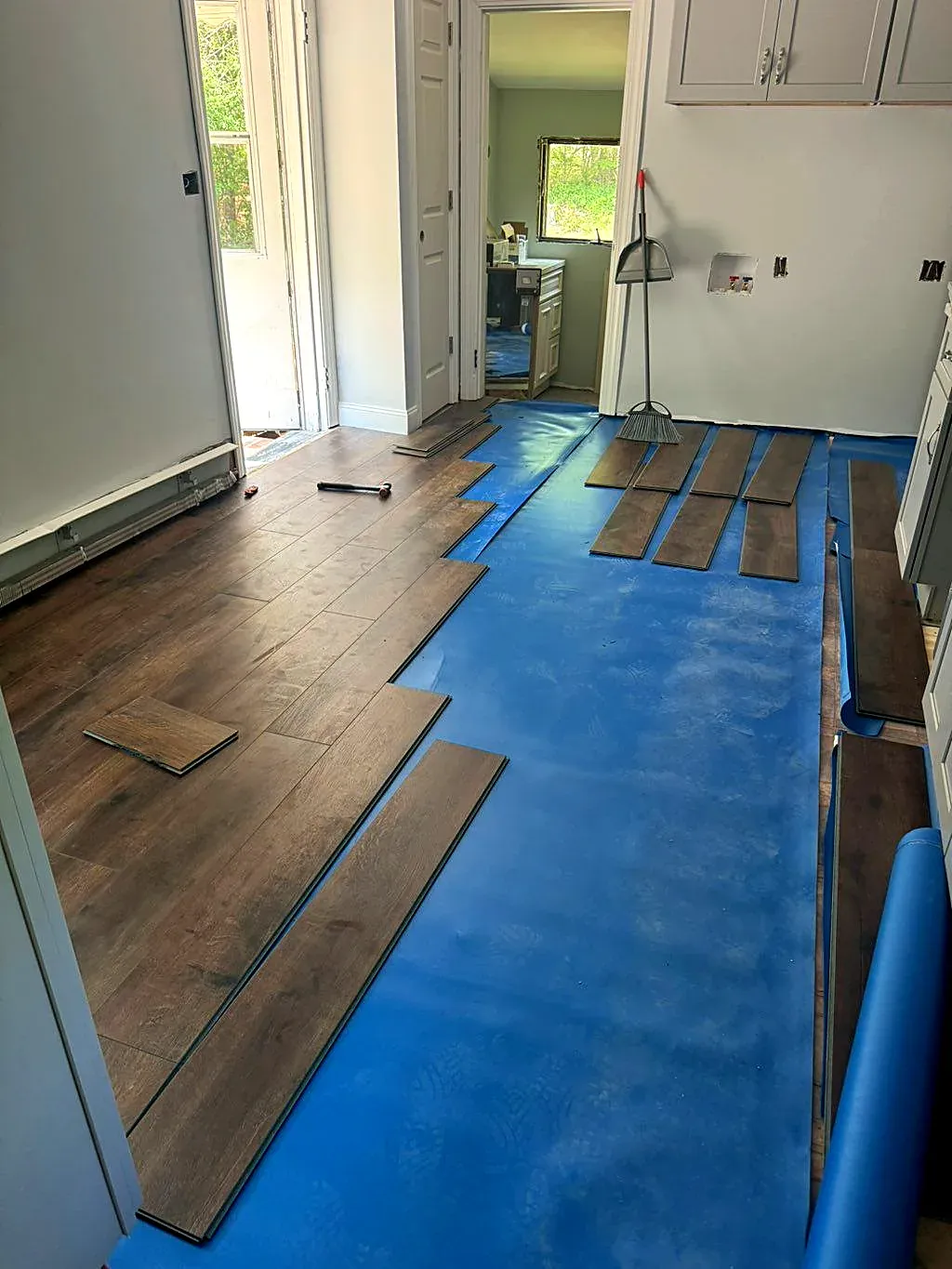 Same room during installation, underlayment exposed