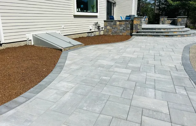 Beautiful stone patio installation with curved design