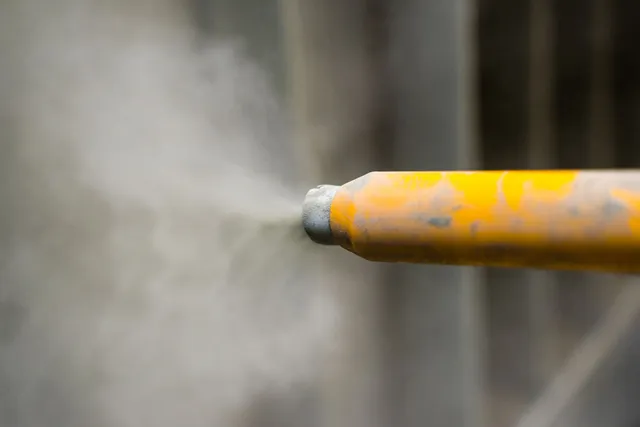 Industrial machinery sandblasting for professional painting preparation