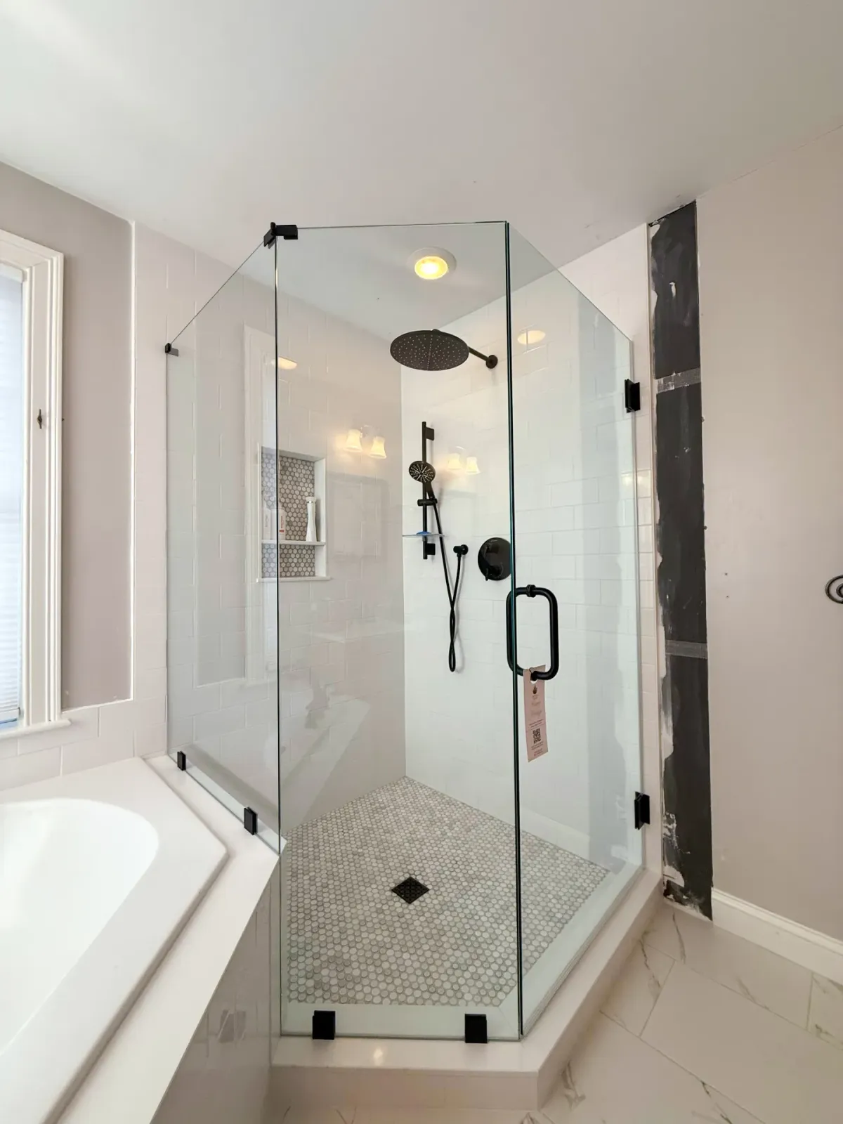 Corner glass shower with matte black hardware