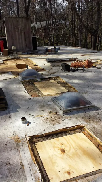 Flat roof tear-off and skylight curb work