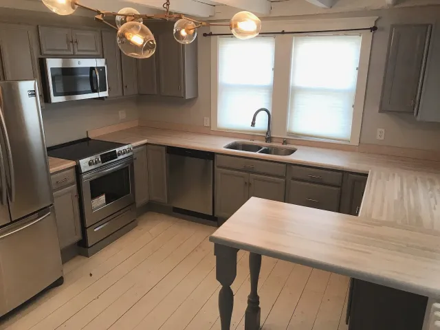 Renovated kitchen in old house with most uneven floors ever seen. Cabinets installed by us