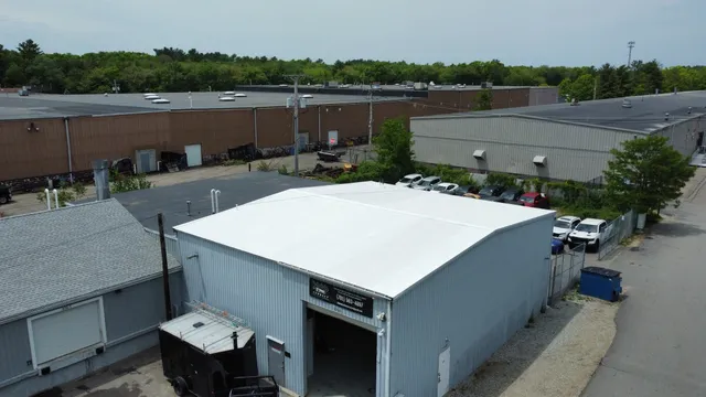 Commercial building with a completed white reflective roof coating