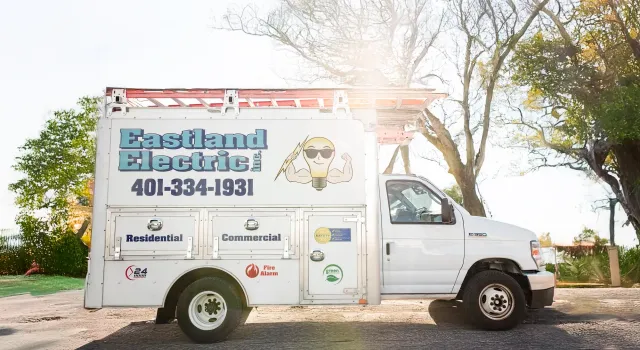 Eastland Electric box truck on job site with sun in background