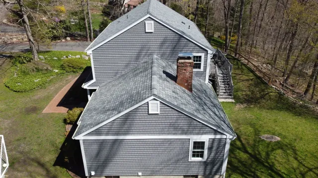 An aerial view of a house with a chimney on the roof.