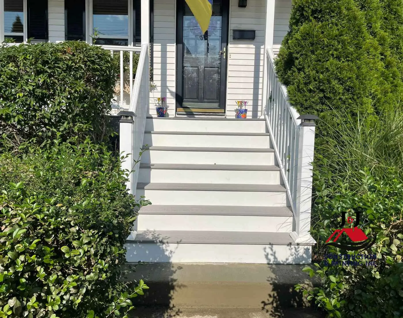 New composite front steps with white railing