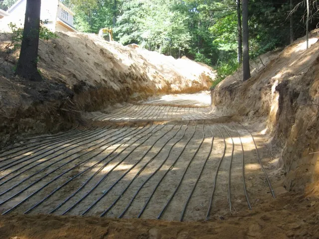 Geothermal loop field trenched beside the house