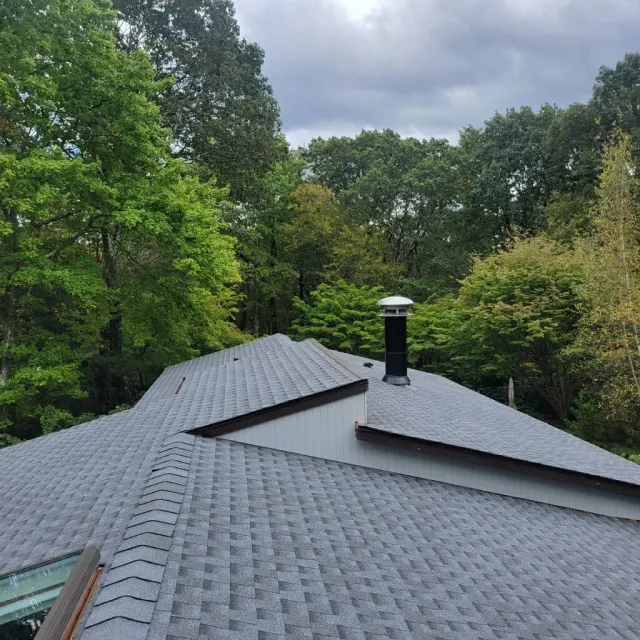 Asphalt shingle roof on a wooded property in New Canaan CT