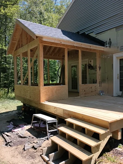 Front framing view of a four-season porch addition in Bedford