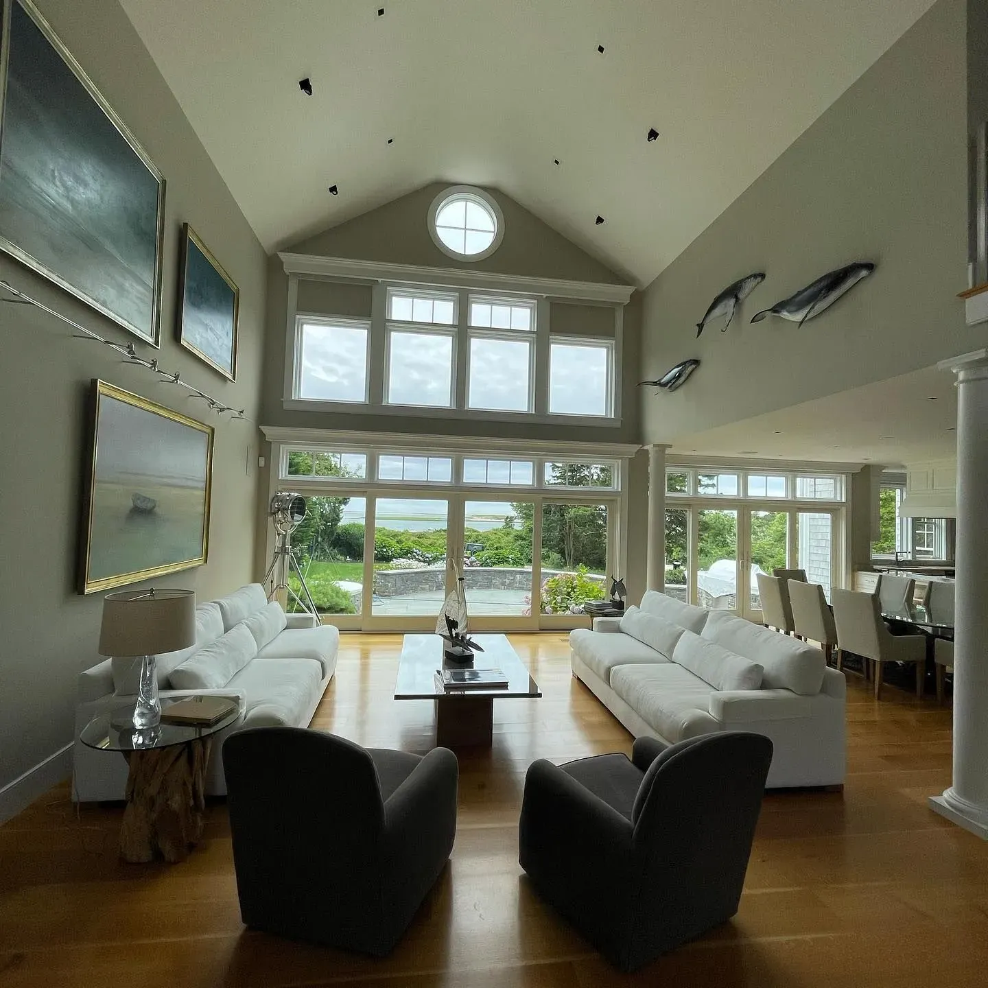 Spacious living room with large clean windows overlooking the ocean | Residential window cleaning Cape Cod