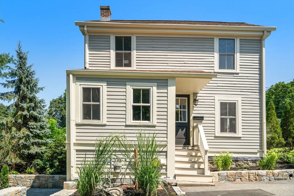Why rent when you can own? Rarely does a home like this come along, a detached condominium that is its own standalone cottage tucked away in a tree-lined pocket of Lower Falls. Thoughtfully renovated in 2022, this 2bedroom home is filled with natural light and blends timeless character with modern updates, featuring an inviting living room, an eat-in kitchen with quartz countertops, stainless steel appliances and gas cooking, beautifully preserved original hardwood floors, and two levels of living space. The primary bedroom offers additional built-in closet storage, while the partially finished walk-out lower level features brand new washer & dryer, abundant storage, and flexible bonus space. Freshly painted with central air, two off-street parking spaces, and move-in ready from day one. Outside is where this home truly shines. Your own private backyard retreat features a newly built stone patio, lush lawn, mature trees, and beautifully landscaped grounds—creating a peaceful oasis that's perfect for entertaining, relaxing, or enjoying summer evenings under the stars. Ideally located in desirable Newton Lower Falls, just steps to Hamilton Field, the Lower Falls Community Center, and the scenic Charles River trails, with easy access to Riverside's Green Line, I-95, the Mass Pike, shopping, dining, and everything Newton has to offer. Must see!