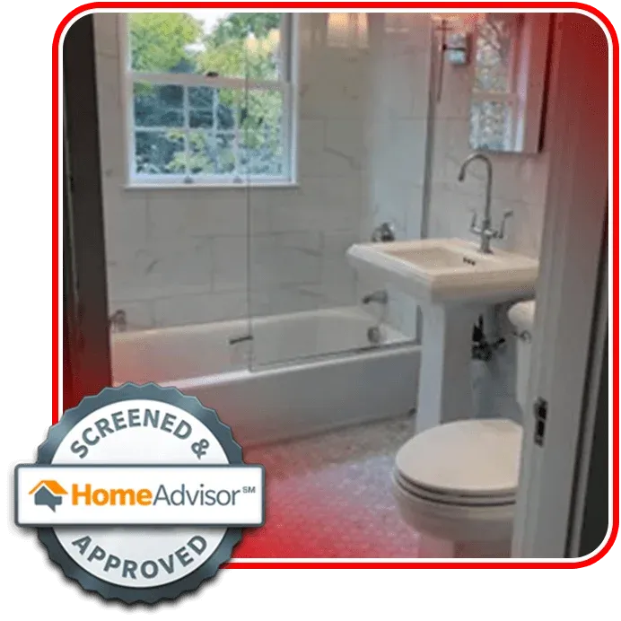 Small bathroom with white tile, pedestal sink, toilet, and bathtub with glass shower doors. A window lets in natural light. Screened & Approved HomeAdvisor badge is displayed in the corner.