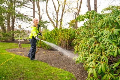 plant health care technician spraying 15
