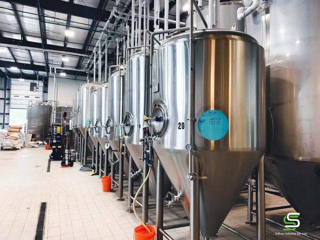 A line of counterweight brewery tanks