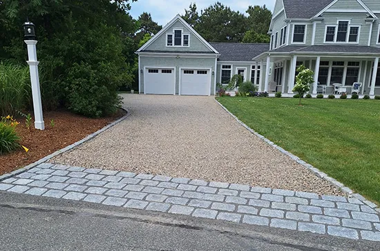 Cobblestone edging a driveway Falmouth, MA