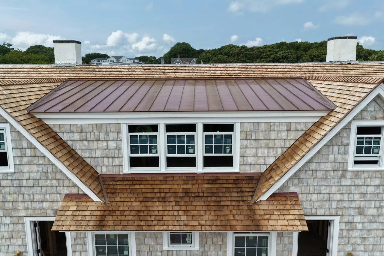 Aerial view of waterfront estate with new cedar roof near the harbor