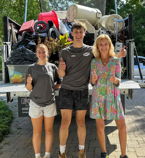 Junkit team with loaded dump truck after junk removal service in Chittenden County Vermont