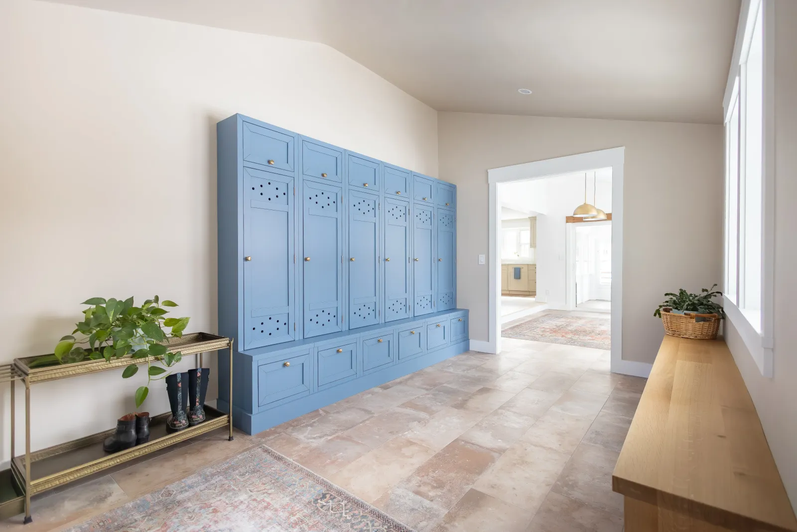 Entry hall with painted blue built-in cabinetry