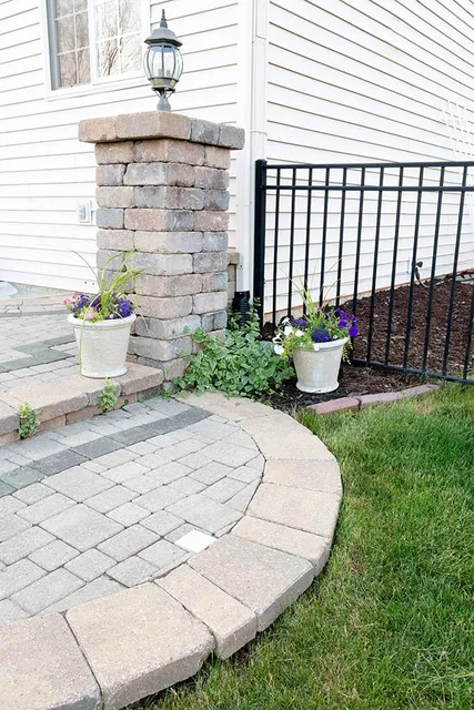 Landscaping contractor with a lawn mower preparing for lawn care services