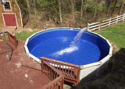 Above ground replacement pool with a wrap-around deck