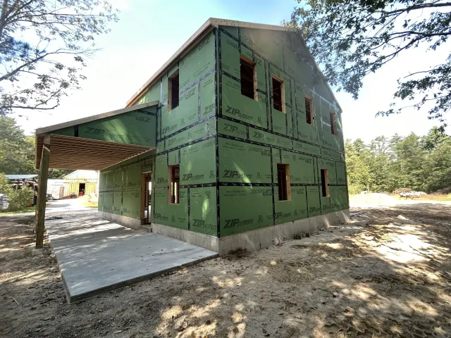 A house is being built in the middle of a forest.