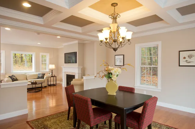 Dining room with coffered ceiling and chandelier