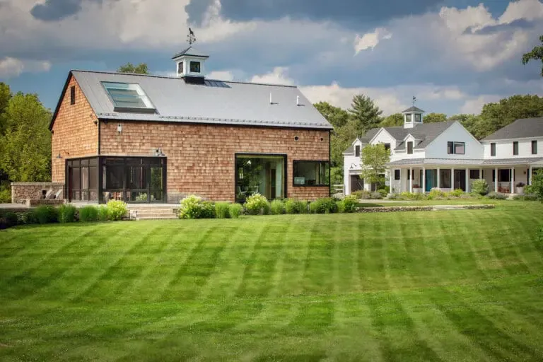 Carlisle, MA - A strong lawn axis visually connects barn and farmhouse, unifying the estate through alignment and proportion. Photo: Michael J. Lee
