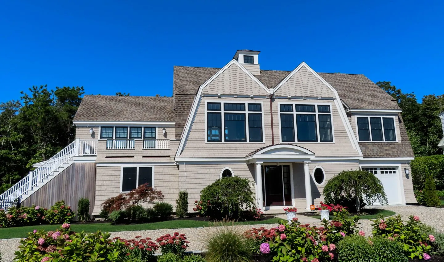 Cream colored house with two large peaks