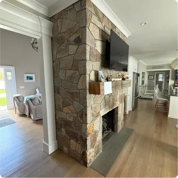 Custom stone outdoor fireplace built on Cape Cod