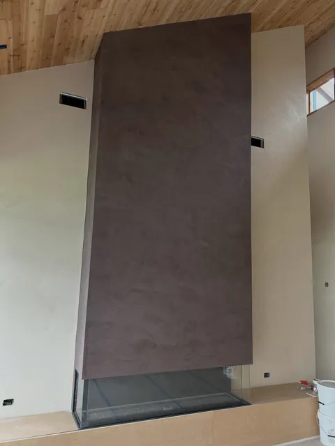 Fireplace finished in marmorino plaster contrasting the Tadelakt plaster throughout this primary sweet for @poparchitecturedpc