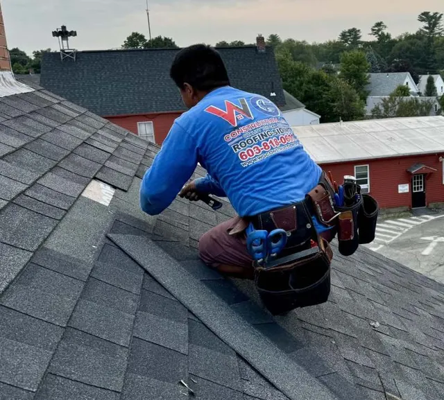 WG Construction technician performing roof repair on asphalt shingles in Raymond, NH