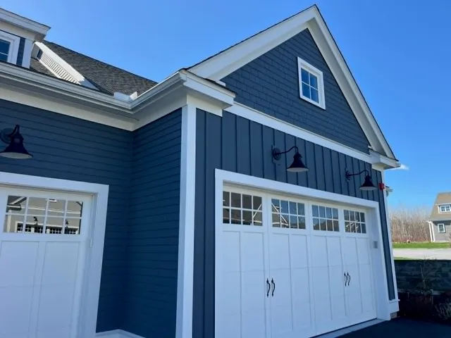 Close-up of precision siding installation around garage