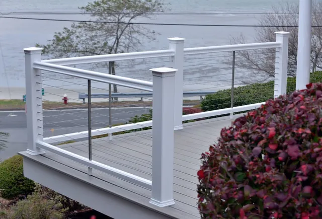 Composite deck with cable railing overlooking the water