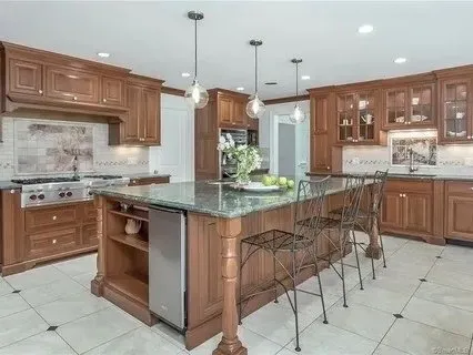 Custom cherry kitchen with a stone island