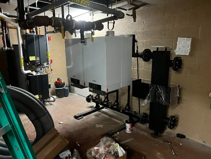 Commercial boiler pair installed with air/dirt separator