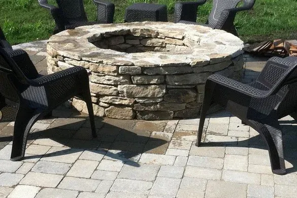 Stone fire pit on a paver patio