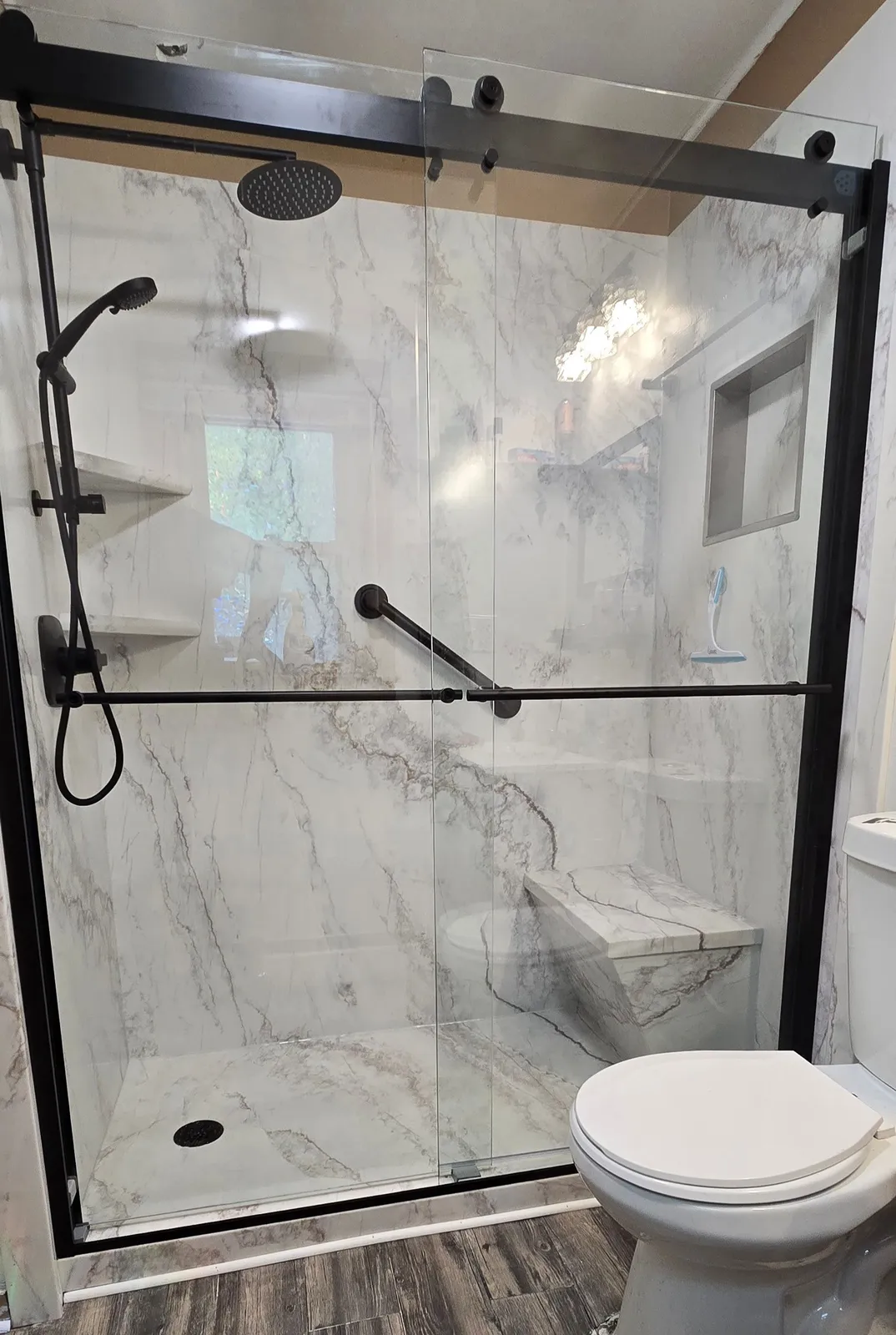 Marble walk-in shower installation by Pro Line Remodeling