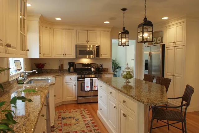 Remodeled kitchen with granite island and custom cabinetry