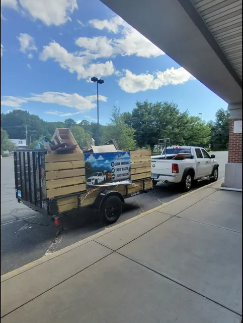 JM Hauling truck and trailer at a pickup