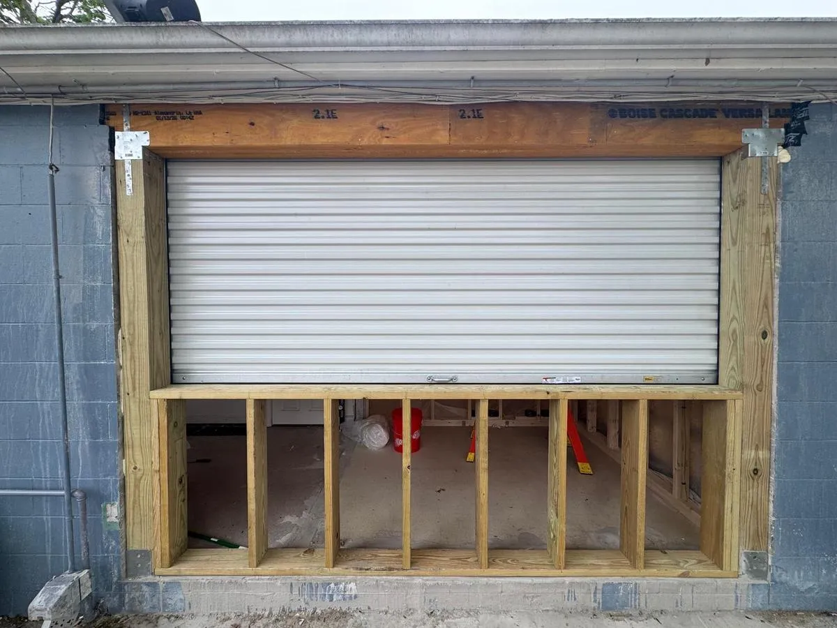 Bluefin commercial roll-up door installation with framing