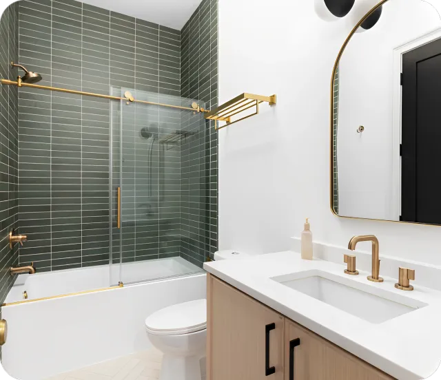 A bathroom with a sink, toilet and bathtub.