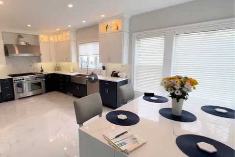 white kitchen renovation with natural light and modern cabinets in Connecticut