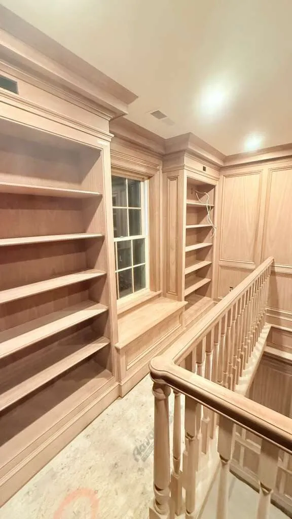 Custom library shelving and window seat