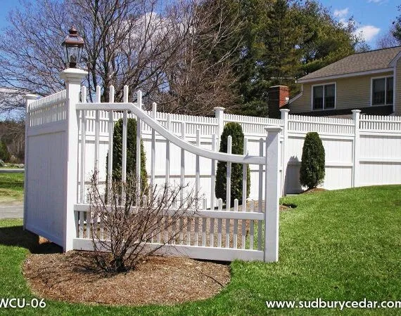 Decorative spindle top privacy fence with custom curved transition.