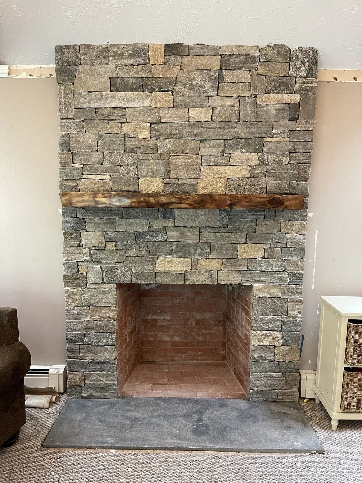 Custom chimney and natural stone veneer fireplace in Douglas Massachusetts