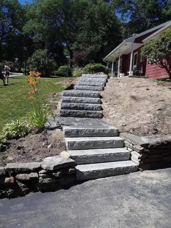 Granite steps set into a hillside in Central MA