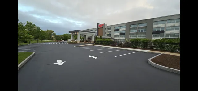Commercial parking lot with fresh asphalt surface in NH
