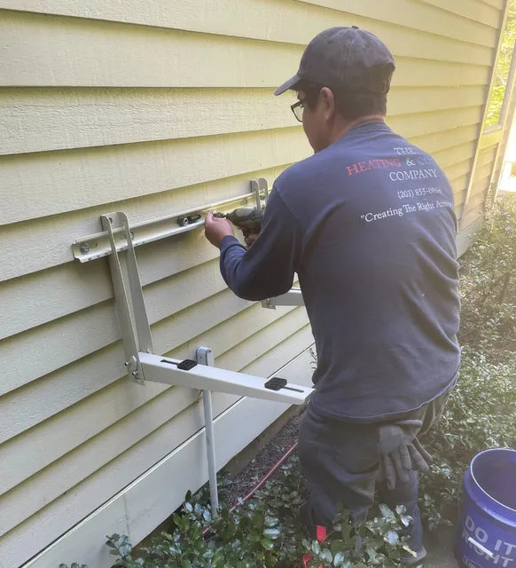 Man Working On Home AC Unit