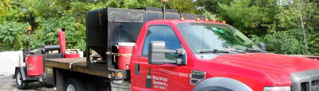 Commercial Sealcoating Truck With NH Blacktop Sealers Logo